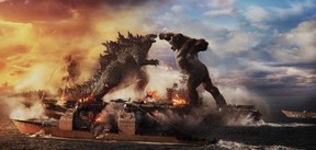 Godzilla and Kong battle in a scene from Godzilla vs. Kong.