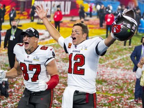 Tampa Bay Buccaneers quarterback Tom Brady and tight end Rob Gronkowski celebrate after beating the Kansas City Chiefs in Super Bowl LV at Raymond James Stadium.