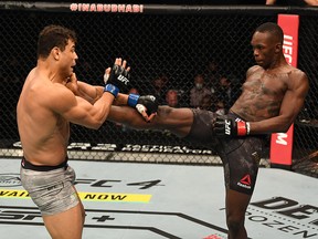 Israel Adesanya kicks Paulo Costa in their middleweight championship bout during UFC 253 inside Flash Forum on UFC Fight Island on September 27, 2020 in Abu Dhabi, United Arab Emirates.