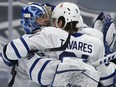 Toronto Maple Leafs' goalie Jack Campbell, left, celebrates his shutout win over the Edmonton Oilers with John Tavares during NHL action at Rogers Place, in Edmonton, Feb. 27, 2021.