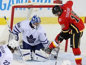 Toronto Maple Leafs goaltender Jack Campbell makes a save on Matthew Tkachuk of the Calgary Flames late in the third period during NHL hockey in Calgary on Jan. 24, 2021.