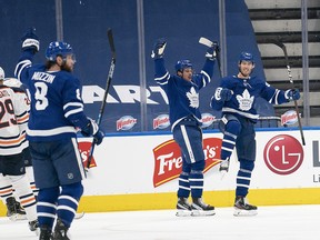 The Toronto Maple Leafs celebrate a goal during Saturday's overtime win over Edmonton.