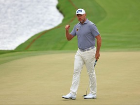 Lee Westwood of England reacts after making a putt for birdie on the 18th green during the third round of the Arnold Palmer Invitational Presented by MasterCard at the Bay Hill Club and Lodge on March 6, 2021 in Orlando, Fla.