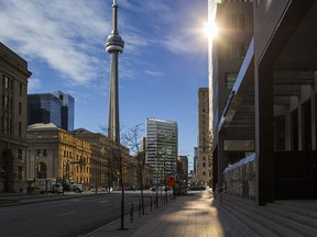 An empty Front St. W. is seen just before the lunch hour in Toronto on Friday January 22, 2021.