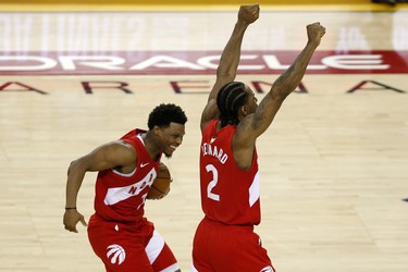 OAKLAND, CALIFORNIA - JUNE 13:  Kyle Lowry #7 and Kawhi Leonard #2 of the Toronto Raptors celebrates his teams win over the Golden State Warriors in Game Six to win the 2019 NBA Finals at ORACLE Arena on June 13, 2019 in Oakland, California. NOTE TO USER: User expressly acknowledges and agrees that, by downloading and or using this photograph, User is consenting to the terms and conditions of the Getty Images License Agreement. (Photo by Lachlan Cunningham/Getty Images)