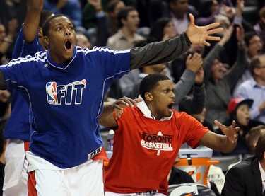 Rudy Gay and Kyle Lowry of the Toronto Raptors celebrate a 3-point shot against the Los Angeles Clippers during NBA action at the Air Canada Centre in Toronto February, 1, 2013. Photo by Dave Abel/Toronto Sun/QMI ORG XMIT: