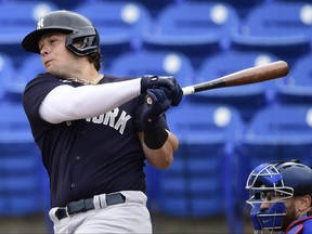Luke Voit of the New York Yankees swings at a pitch during the first inning against the Toronto Blue Jays during a spring training game at TD Ballpark on March 21, 2021 in Dunedin, Fla.