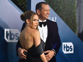 In this file photo taken Jan. 19, 2020, Jennifer Lopez and Alex Rodriguez arrive for the 26th Annual Screen Actors Guild Awards at the Shrine Auditorium in Los Angeles.