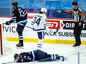 Maple Leafs forward Auston Mathews (34) celebrates his goal against the Winnipeg Jets at Bell MTS Place.