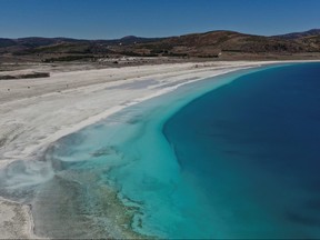 A general view of Salda Lake in Burdur province, Turkey, March 1, 2021. The official Twitter account of NASA Earth mentioned lake Salda in their tweet a day before NASA rover Perseverance touched down on Mars. Picture taken with a drone on March 1, 2021. REUTERS/Umit Bektas ORG XMIT: HFS-ANK18