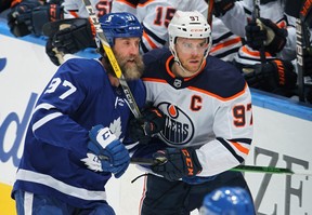 Leafs forward Joe Thornton checks Oilers superstar Connor McDavid. Could these two teams be destined to clash in the playoffs? GETTY IMAGES