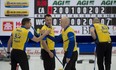 Second John Morris (left) and skip Kevin Koe shake hands after defeating Brad Gushue's Team Canada 9-7 on Sunday.