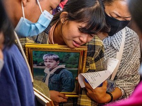 A relative cries during the funeral of a protester, who died amid a crackdown by security forces on demonstrations against the military coup, in Taunggyi in Myanmar's Shan state on March 29, 2021.