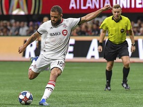 Toronto FC midfielder Nick DeLeon (18) scores the game-winning goal against Atlanta United at Mercedes-Benz Stadium.