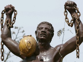 This photo taken on May 5, 2006 shows the liberation from slavery statue in a street leading to the House of Slaves on Goree Island, just off Dakar, Senegal, where thousands of African slaves were held before being sent to the Americas.