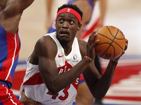 Raptors Pascal Siakam pump-fakes the ball against Detroit Pistons Isaiah Stewart during the second quarter at Little Caesars Arena on Wednesday, March 18, 2021.