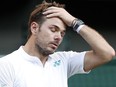 This file photo taken on July 3, 2017 shows Stan Wawrinka reacting against Daniil Medvedev during their match on the first day of the Wimbledon Championships.