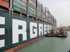 Stranded container ship Ever Given, one of the world's largest container ships, is seen after it ran aground, in Suez Canal, Egypt March 25, 2021.