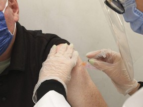 Toronto Sun sports reporter and columnist Steve Buffery received an AstraZeneca COVID-19 vaccine shot in Toronto on Friday, March 12, 2021.