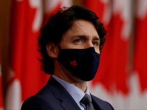 Prime Minister Justin Trudeau, wearing a protective face mask, attends a news conference, as efforts continue to help slow the spread of COVID-19, in Ottawa, March 5, 2021.