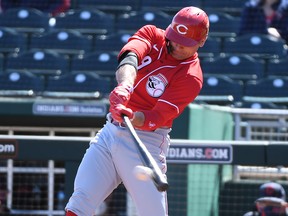 Joey Votto of the Cincinnati Reds bats against the Cleveland Indians during a spring training game at Goodyear Ballpark on February 28, 2021 in Goodyear, Arizona.