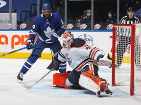 Maple Leafs forward Wayne Simmonds (left) looks for a rebound as Mike Smith of the Edmonton Oilers makes a toe save on Saturday night. The game was the fourth for Simmonds since returning from a broken wrist.