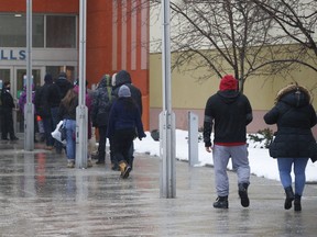 Small groups of people arrive at Vaughan Mills shopping centre as York Region entered in the red zone on Monday, Feb. 22, 2021.
