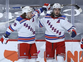 Artemi Panarin (left) and Mika Zibanejad of the New York Rangers celebrate after a goal against the Philadelphia Flyers at the Wells Fargo Center on March 25, 2021 in Philadelphia.