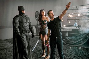 Zack Snyder, right, directs Batman (Ben Affleck) and Wonder Woman (Gal Gadot) during filming of Justice League.