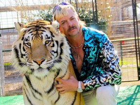 This undated file photo courtesy of Netflix shows Joseph "Joe Exotic" Maldonado-Passage with one of his tigers.