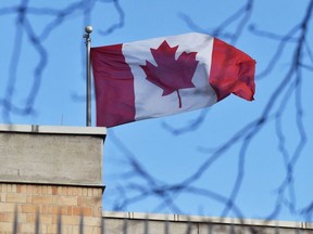 In this file photo the Canadian flag flies above the Canadian embassy in Beijing on January 15, 2019.
