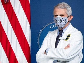 White House Chief Medical Adviser on Covid-19 Dr. Anthony Fauci listens as US President Joe Biden (out of frame) speaks during an event in the Eisenhower Executive Office Building in Washington, DC, February 25, 2021.