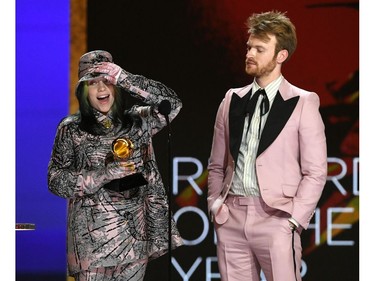 In this handout photo courtesy of The Recording Academy, US singer-songwriter Billie Eilish and Finneas accept the Record of the Year award for 'Everything I Wanted' onstage during the 63rd Annual GRAMMY Awards at Los Angeles Convention Center on March 14, 2021 in Los Angeles.