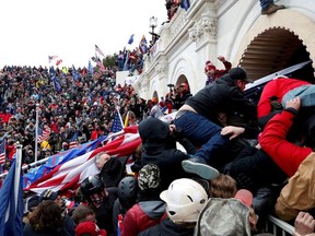 Pro-Trump protesters storm into the U.S. Capitol during clashes with police, during a rally to contest the certification of the 2020 U.S. presidential election results by the U.S. Congress, in Washington, U.S, January 6, 2021.