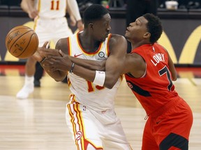 Toronto Raptors guard Kyle Lowry pressures Atlanta Hawks guard Tony Snell during the first half at Amalie Arena.