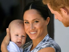 Britain's Prince Harry and his wife Meghan, Duchess of Sussex holding their son Archie, meet Archbishop Desmond Tutu (not pictured) at the Desmond & Leah Tutu Legacy Foundation in Cape Town, South Africa, September 25, 2019.