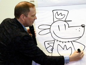 Author and cartoonist Dav Pilkey shows how he draws Dog Man, Saturday, Aug. 17, 2019, at the Mississippi Book Festival in Jackson, Miss.