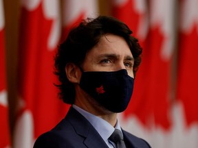 Canada's Prime Minister Justin Trudeau, wearing a protective face mask, attends a news conference, as efforts continue to help slow the spread of the coronavirus disease (COVID-19), in Ottawa, Ontario, Canada March 5, 2021.