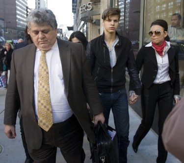 Oliver Karafa (middle), then 19, faced charges (later convicted) of criminal negligence causing death and impaired driving causing death when he was released on bail and left the College Park courts with his parents, sister and lawyer (left) on Thursday, April 5, 2012.