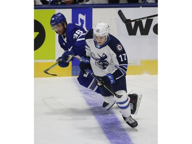 Manitoba Moose Cole Perfetti C (17) heads up the ice past Toronto Marlies Colt Conrad F (36) during the first period in Toronto on Monday March 1, 2021. Jack Boland/Toronto Sun/Postmedia Network