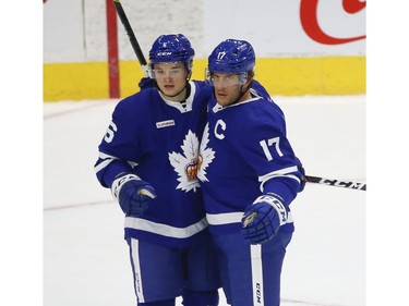 Toronto Marlies Rich Clune LW (17) celebrates a goal with teammate Teemu Kivihalme D (6) during the second period in Toronto on Monday March 1, 2021. Jack Boland/Toronto Sun/Postmedia Network