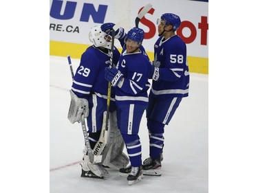 Toronto Marlies Rich Clune LW (17) celebrates the 4-2 win with goalie Andrew D'Agostini G (29) after the game  in Toronto on Monday March 1, 2021. Jack Boland/Toronto Sun/Postmedia Network