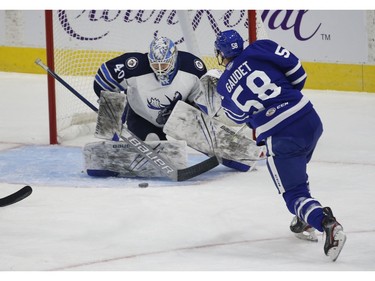Manitoba Moose Mikhail Berdin G (40) makes a point blank save on Toronto Marlies Tyler Gaudet C (58) during the first period in Toronto on Monday March 1, 2021. Jack Boland/Toronto Sun/Postmedia Network