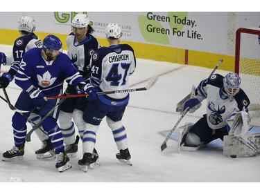 Toronto Marlies Alex Galchenyuk C (12) tips a puck at Manitoba Moose Mikhail Berdin G (40) during the first period in Toronto on Monday March 1, 2021. Jack Boland/Toronto Sun/Postmedia Network