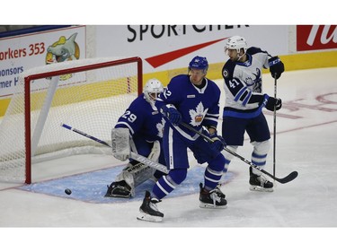 \\Manitoba Moose Cole Maier C (41) looks back past Toronto Marlies Martin Marincin D (52) and goalie Andrew D'Agostini G (29) after the puck went off the post during the first period in Toronto on Monday March 1, 2021. Jack Boland/Toronto Sun/Postmedia Network