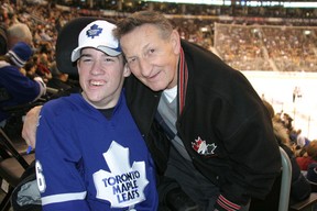 Walter Gretzky poses for a photo with Nick Heighington, left, in 2010.