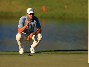 Corey Conners of Canada lines up a putt on the 8th green during the first round of the Arnold Palmer Invitational Presented by MasterCard at the Bay Hill Club and Lodge on March 04, 2021 in Orlando