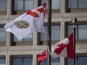 The Canadian Forces flag flies outside office buildings in Ottawa, Tuesday March 9, 2021.
