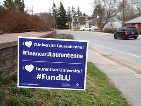 One of the signs that have been popping up in Sudbury, Ont., showing support for students, staff and faculty at Laurentian University is seen on April 12, 2021..