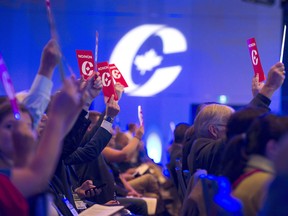 Delegates vote on party constitution items at the Conservative Party of Canada national policy convention in Halifax Aug. 24, 2018.
